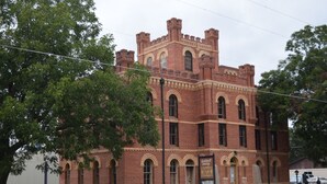 A large brick building with arched windows and a central tower, labeled as a museum. - Our Cozy, Quiet, Comfortable place in the Country - 2 Bedroom 900 sq ft w/view (Lockhart)