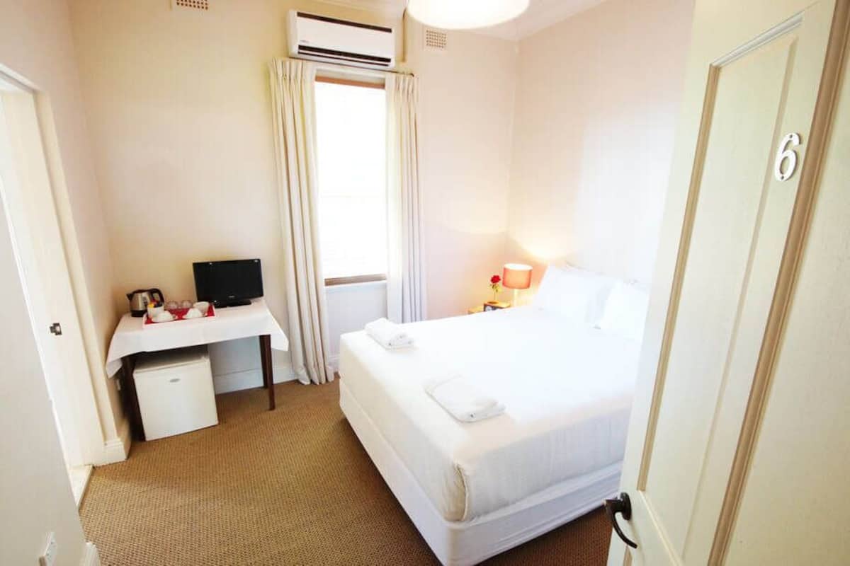 Premium bedding, down duvets, desk, laptop workspace