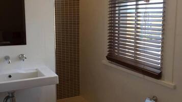 Shower, rainfall showerhead, hair dryer, towels
