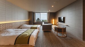 A hotel room with two beds, a sofa, a TV, and a window with a view. - Ishinoya Atami (TKP Hotels & Resorts) (Atami)