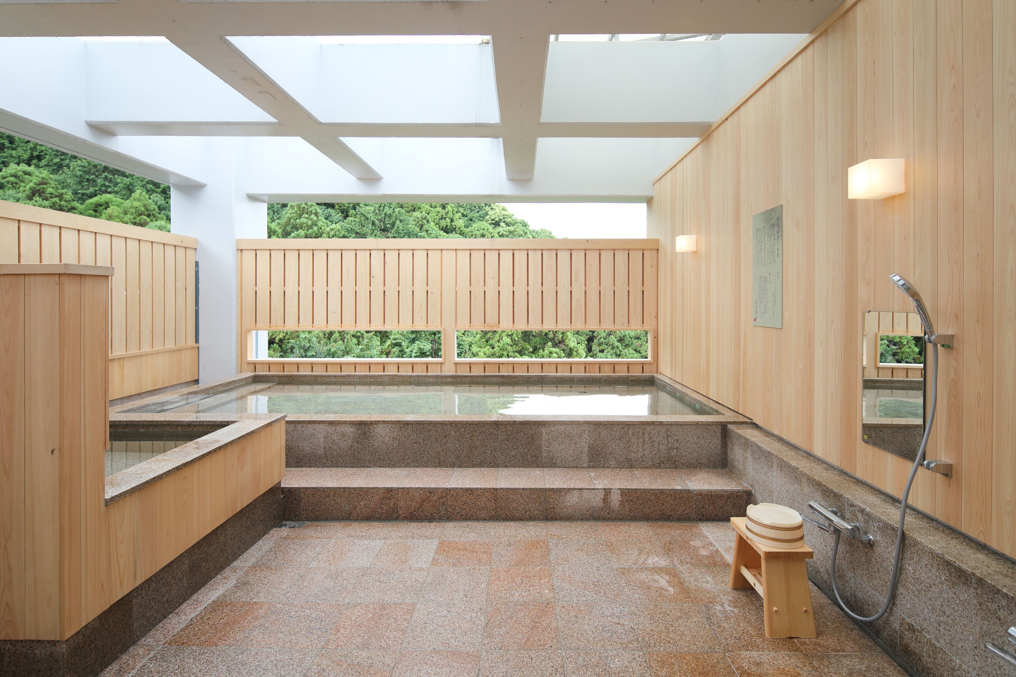 combined shower/bathtub, deep-soaking bathtub, slippers, towels