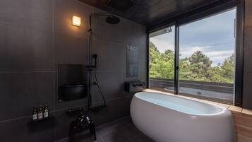 Junior Suite with Sauna & Hot Spring, ocean view/Non-Smoking | Bathroom | Combined shower/tub, deep soaking tub, slippers, towels