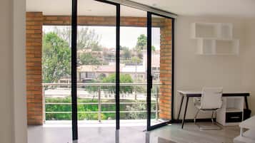Deluxe Double Room | Living area | 42-inch TV with cable channels, streaming services