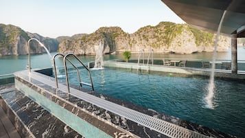 Outdoor pool, open 6:00 AM to 9:00 PM, pool umbrellas