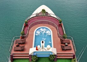 Outdoor pool, open 6:00 AM to 9:00 PM, pool umbrellas