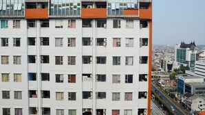 A multi-story building with numerous windows and balconies. - Best Choice 2BR Apartment at Menteng Square (Jakarta)