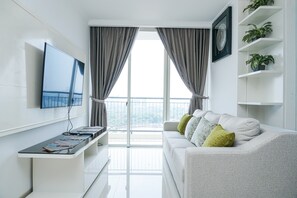 Room | Living room | TV - Stunning 2 Bedrooms Apartment at Ancol Mansion (Jakarta)