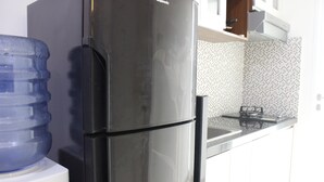 Room | Private kitchen - Comfortable 1BR Apartment at Parahyangan Residence near Unpar (Bandung)