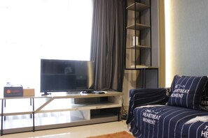Room | Living area | Flat-screen TV - Modern 2BR Apartment at Tamansari Tera Residence Bandung (Bandung)