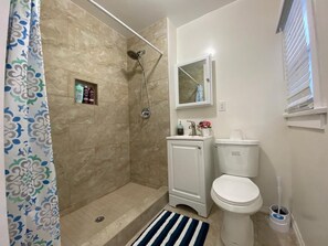 Shower, hair dryer, towels, soap