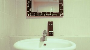 Room | Bathroom sink - Cozy Studio at UC Apartment (Surabaya)
