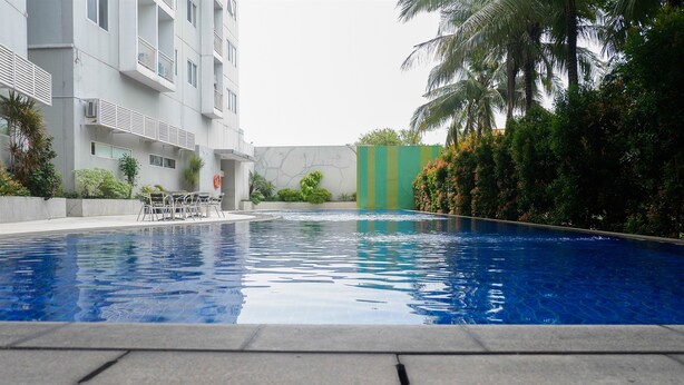Outdoor pool - Cozy Studio at UC Apartment (Surabaya)