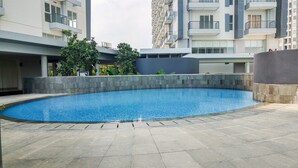 Pool - Cozy and Luxurious Studio Casa de Parco Apartment (Pagedangan)