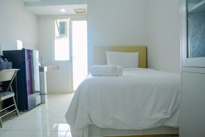 Room | Free WiFi, bed sheets - Cozy Studio Apartment at Margonda Residence 4 (Depok)