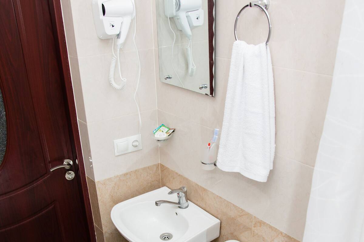Shower, free toiletries, hair dryer, slippers