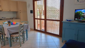 Standard Condo, 1 Bedroom, Patio | Living area | 32-inch LCD TV with digital channels, TV