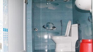 Economy Room | Bathroom | Shower, towels - Tiger Corner Inn (Sauraha)