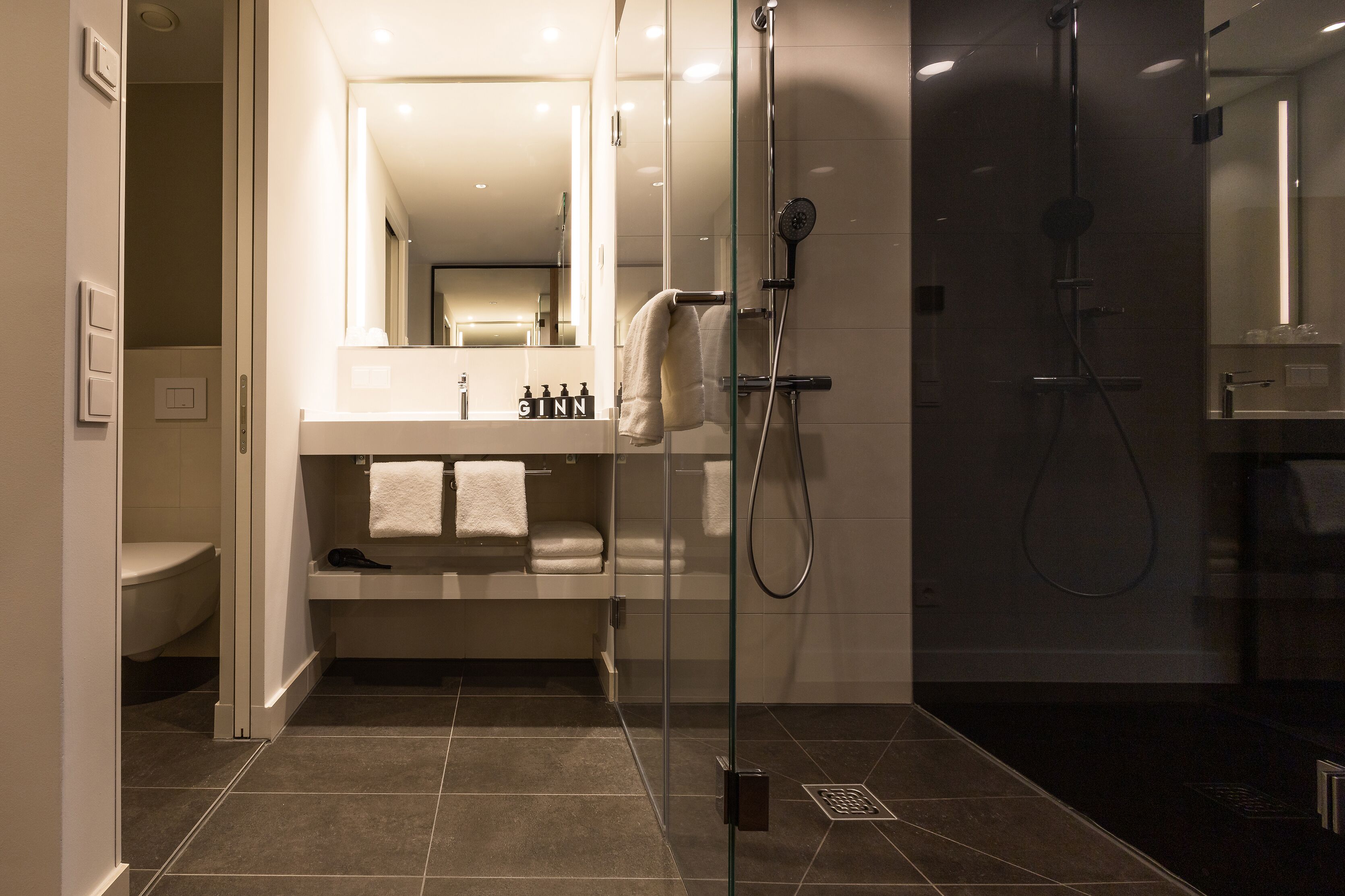 shower, eco-friendly toiletries, hair dryer, towels