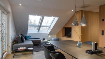 Departamento superior | Área de sala de estar | Televisión de pantalla plana de 42 pulgadas con canales vía satélite