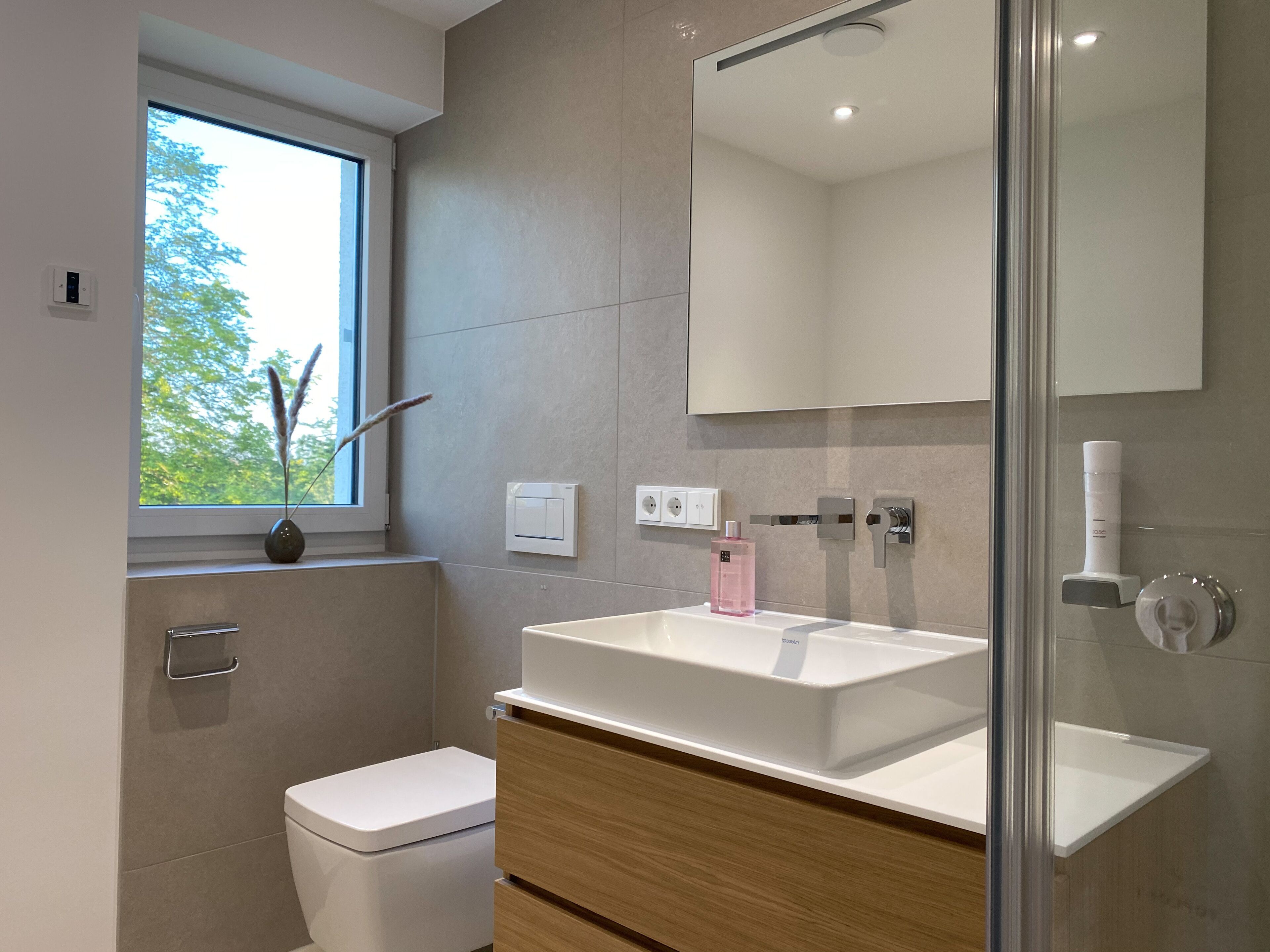 deluxe apartment | bathroom | shower, rainfall showerhead, hair dryer, heated floors