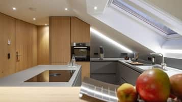 Superior Apartment | Private kitchen | Espresso maker, electric kettle, cleaning supplies, paper towels