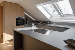 Superior Apartment | Private kitchen | Espresso maker, electric kettle, cleaning supplies, paper towels