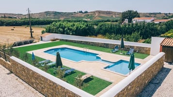 Seasonal outdoor pool, open 10:00 AM to 7:00 PM, sun loungers