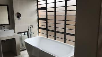 Bathtub, hair dryer, towels