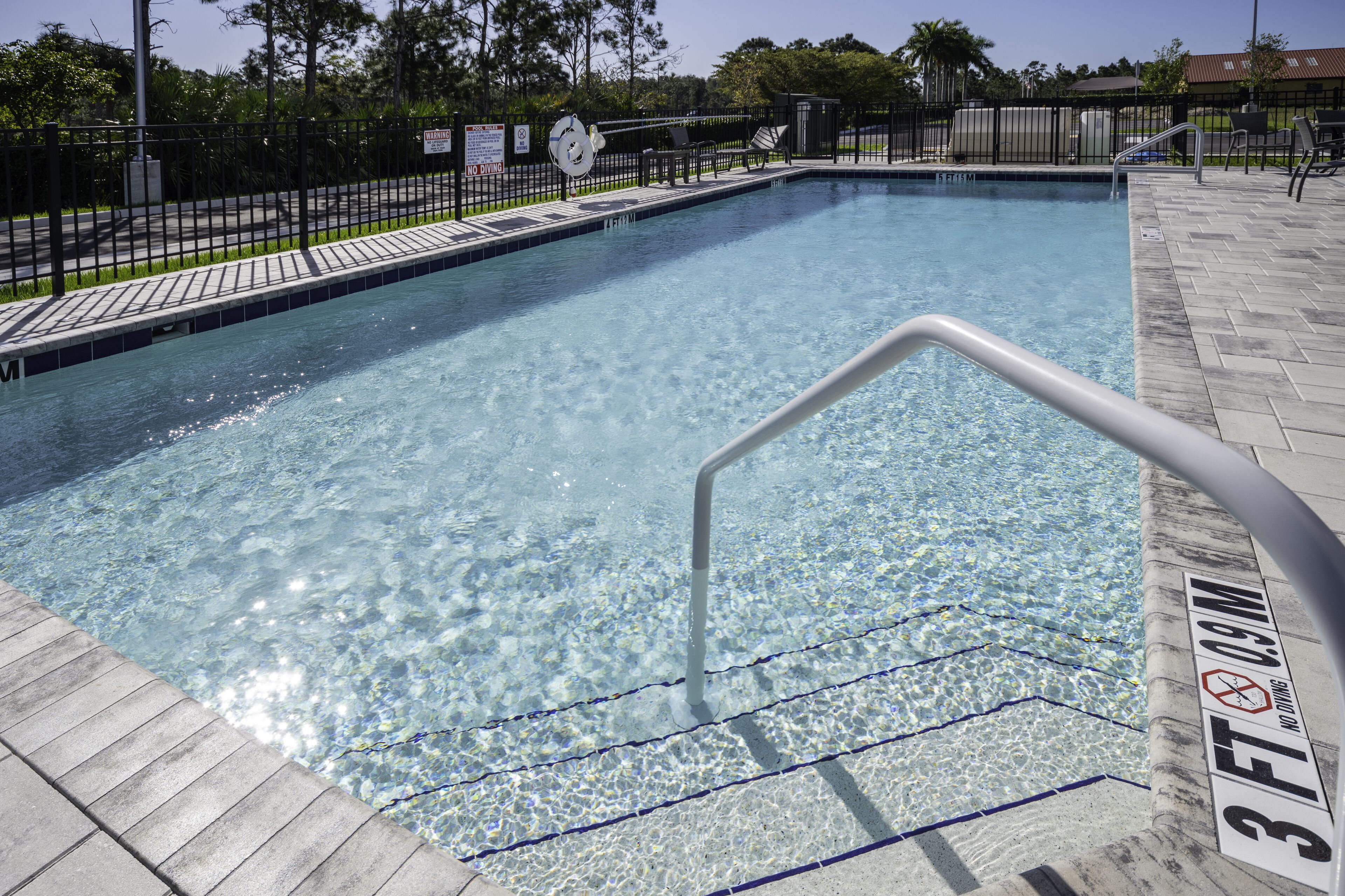 Outdoor pool, open 7:00 AM to 10:00 PM, pool loungers