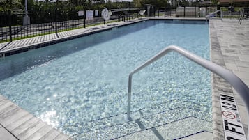 Outdoor pool, open 7:00 AM to 10:00 PM, pool loungers