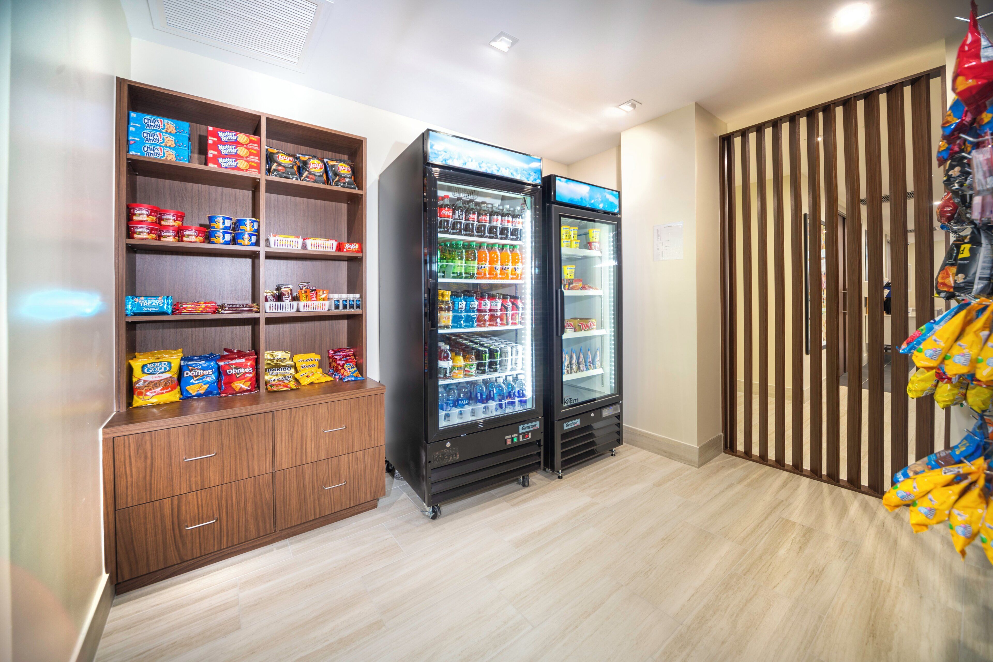 A snack and beverage vending area with various snack options and a selection of drinks.