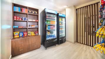 A snack and beverage vending area with various snack options and a selection of drinks.