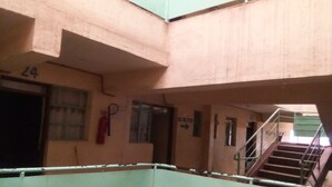 A multi-level building with a staircase leading to an upper floor. - Loika Guest Lodge - Nakuru (Nakuru)