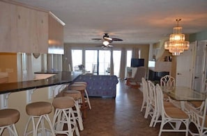 Enjoy casual dining and socializing in this well-equipped kitchen with a central island and dining area.