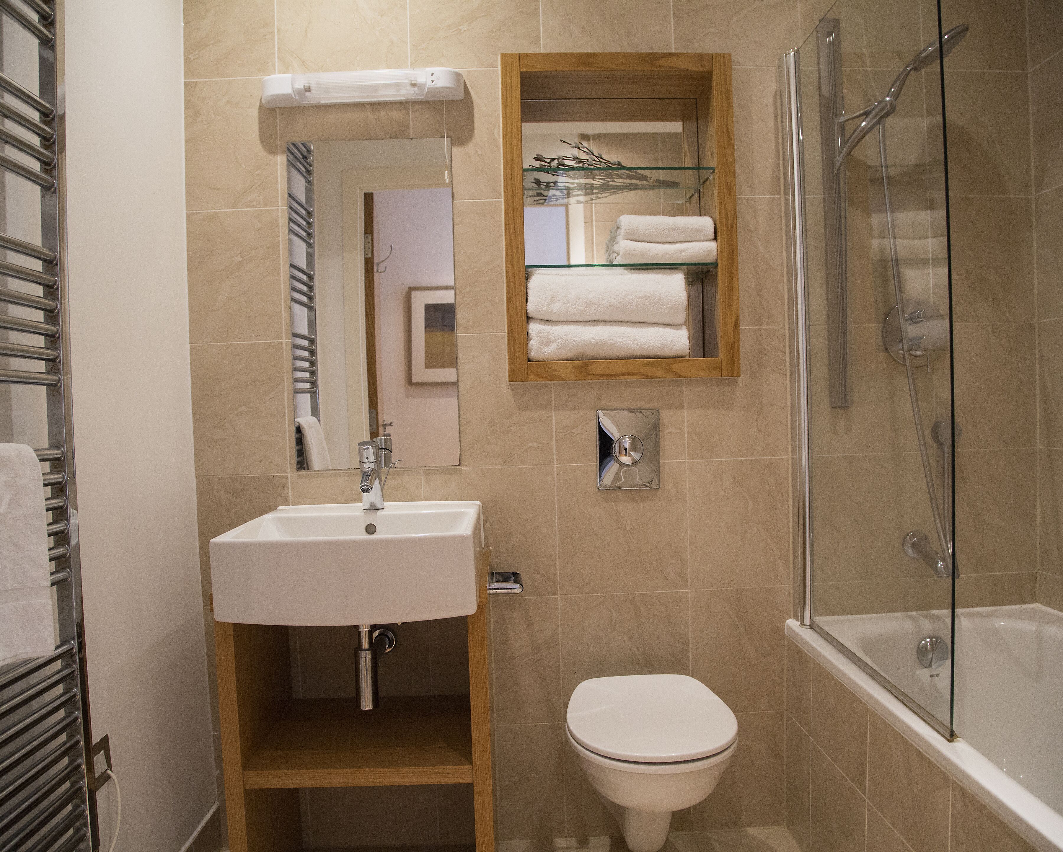 Combined shower/bathtub, towels, soap, toilet paper