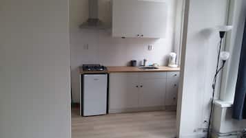 Fridge, stovetop, coffee/tea maker, cookware/dishes/utensils