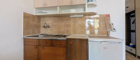 Fridge, stovetop, espresso maker, cookware/dishes/utensils