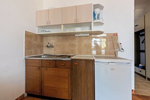 Fridge, stovetop, espresso maker, cookware/dishes/utensils