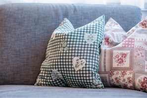 A couch with decorative pillows.