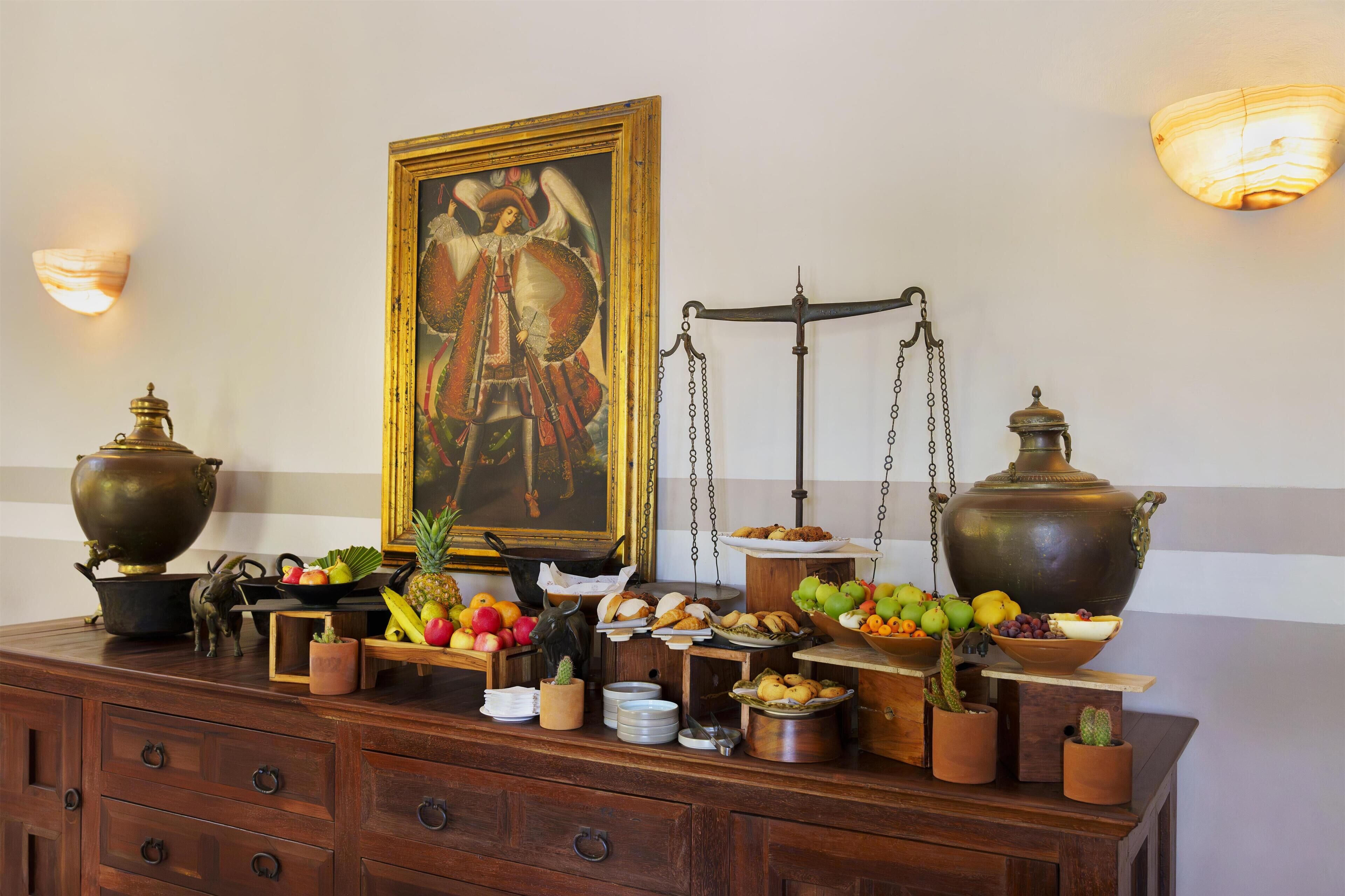 A buffet setup with various food items and decorative elements.