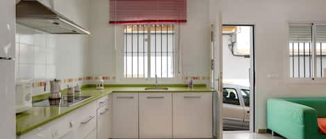 Fridge, microwave, stovetop, coffee/tea maker