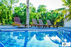 Outdoor pool, pool umbrellas, sun loungers