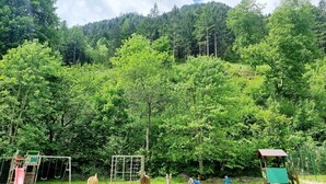 A playground with swings, slides, and climbing structures.
