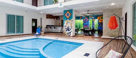 Indoor pool, open 7:00 AM to 10:00 PM, pool loungers