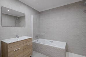 Bathtub, hair dryer, towels