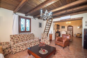 TV, fireplace - Villa Peditoltu with sea view, mountain view, garden, pool and terrace (Olbia)