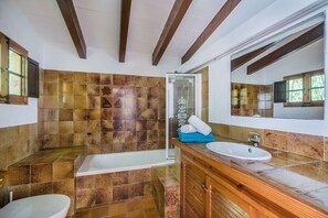 Bathtub, hair dryer, towels