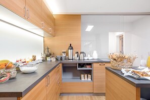 Fridge, stovetop, coffee/tea maker, electric kettle