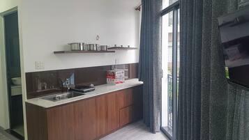 Fridge, electric kettle, cookware/dishes/utensils