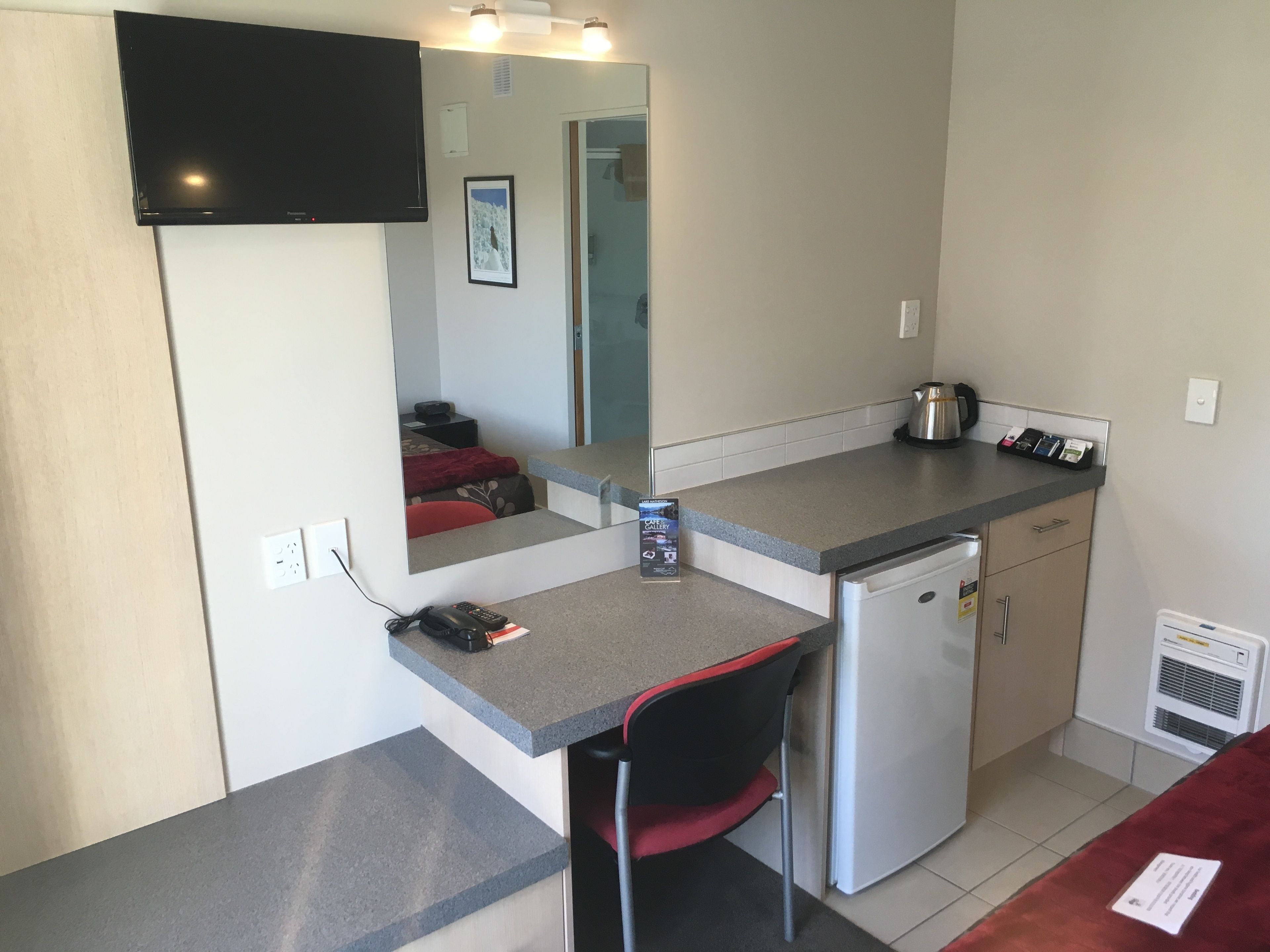 Compact Queen Studio | Desk, blackout curtains, soundproofing, iron/ironing board